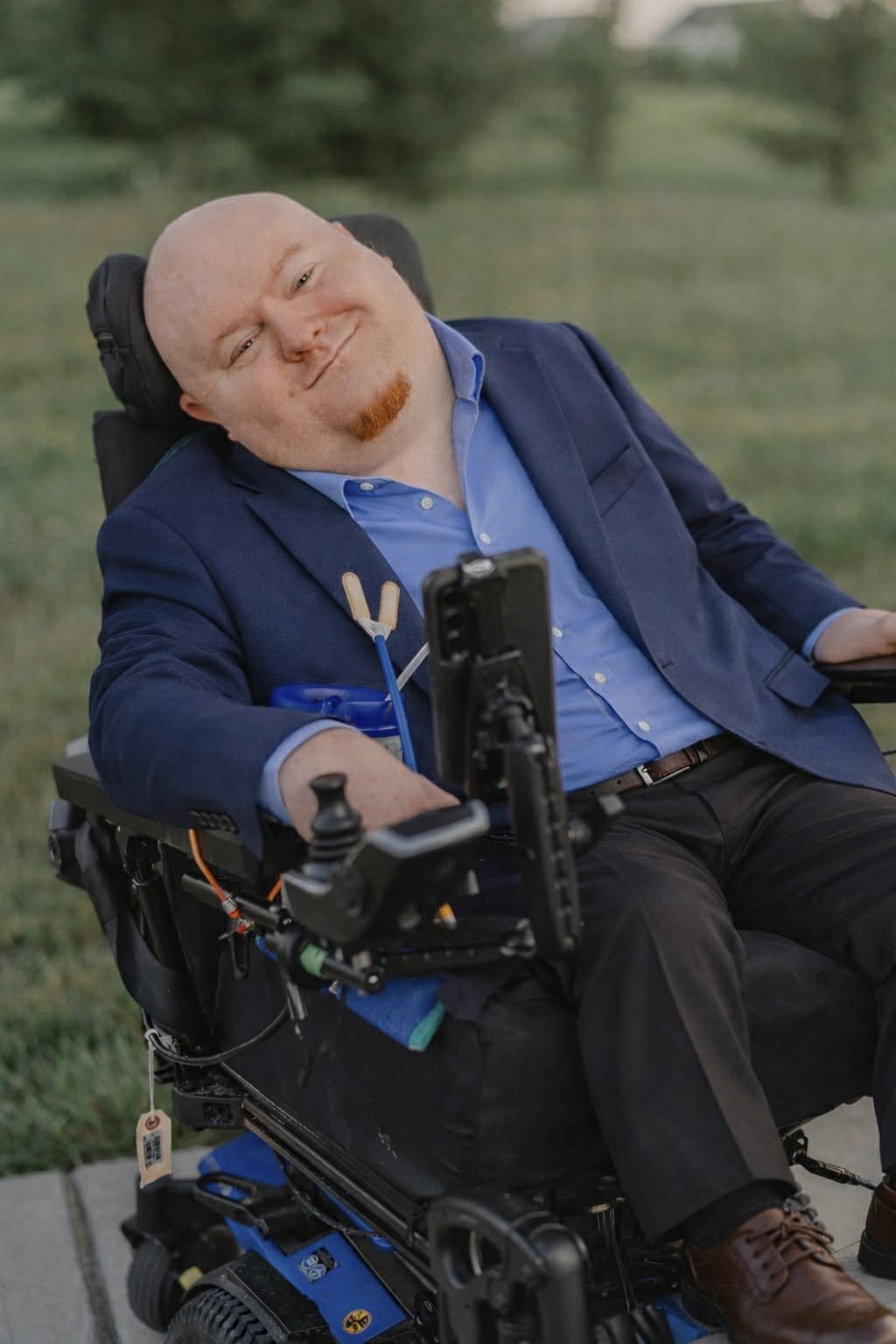 Nathan Powell, founder and president, in his power wheelchair